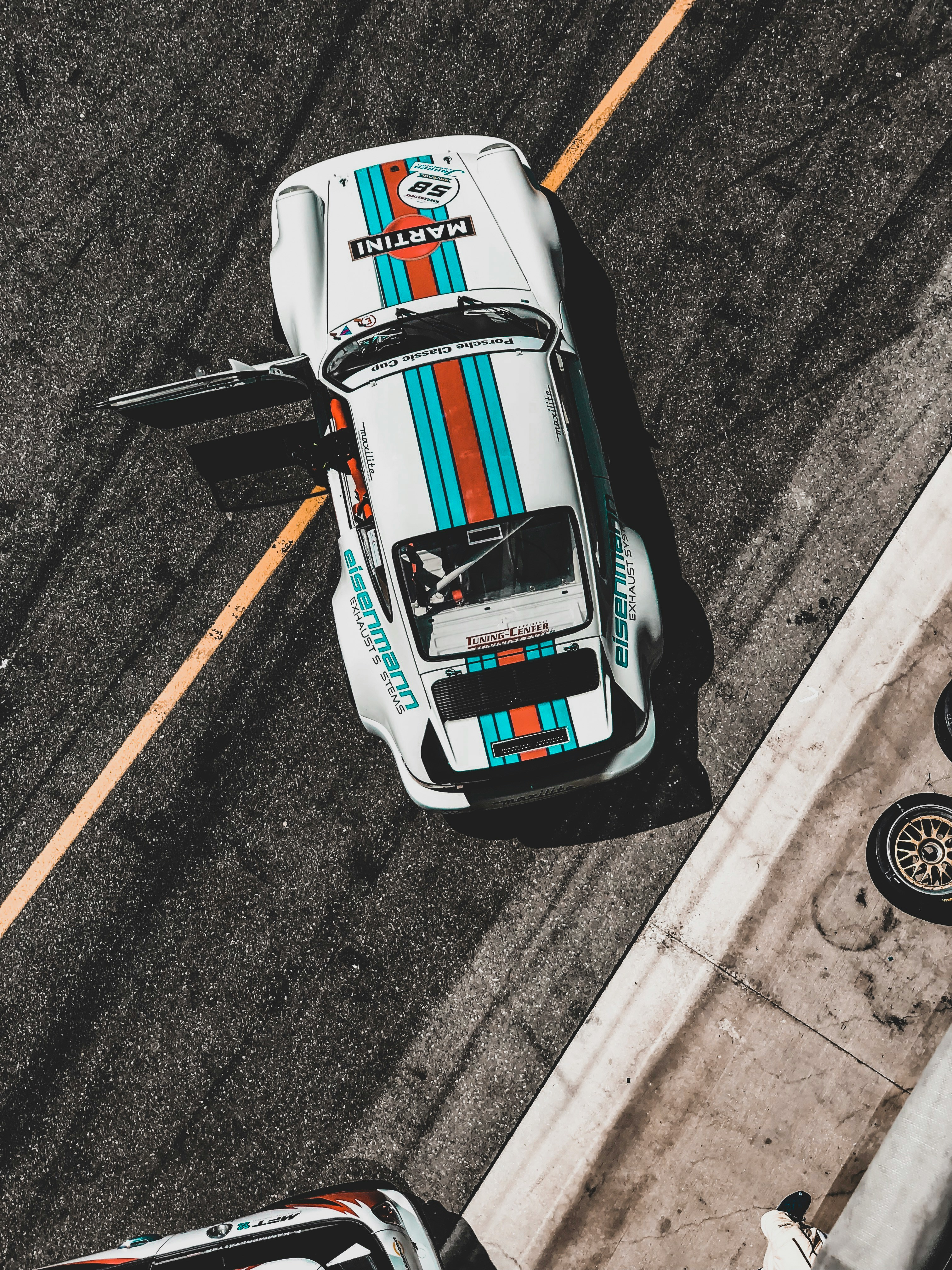 A porsche on the side of the road
